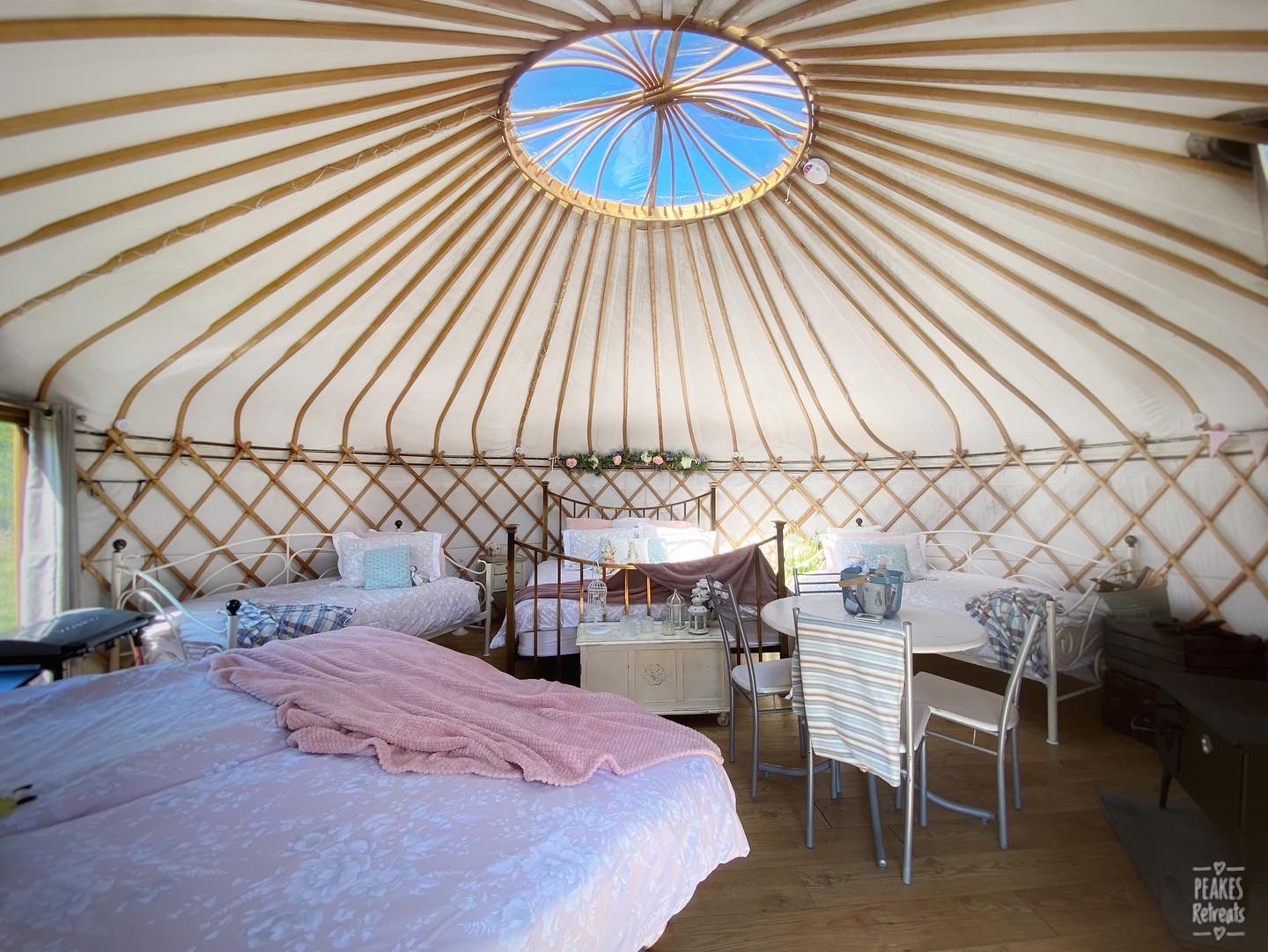 yurt interior with skylight and 6 beds